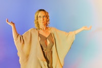 a woman with her arms outstretched